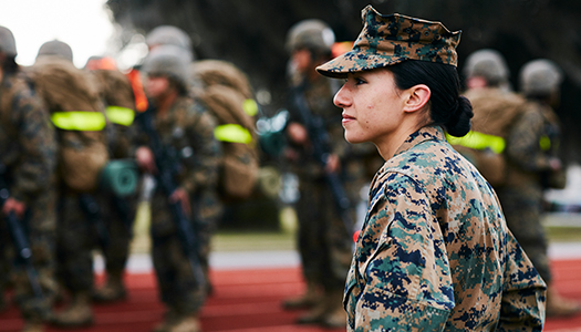 A Marine Corps service member oversees a drill