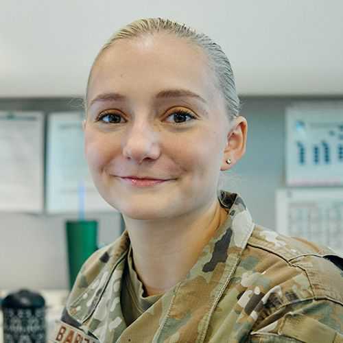 Woman in U.S. Air Force uniform smiling and facing forward