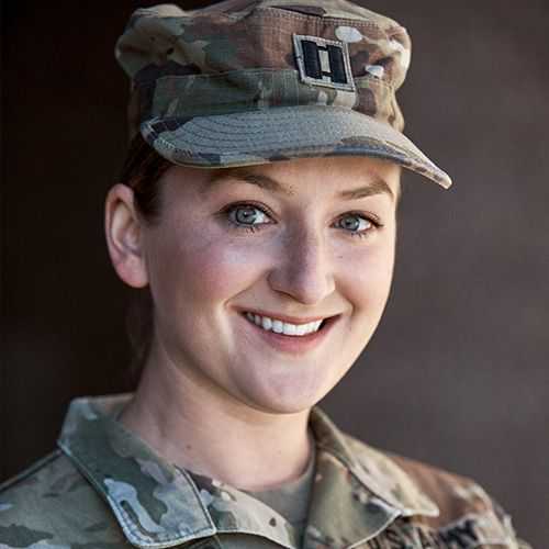 Woman in U.S. Army Reserve uniform smiling and facing forward