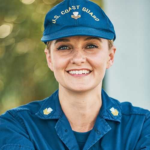 Woman in U.S. Coast Guard Reserve uniform smiling and facing forward