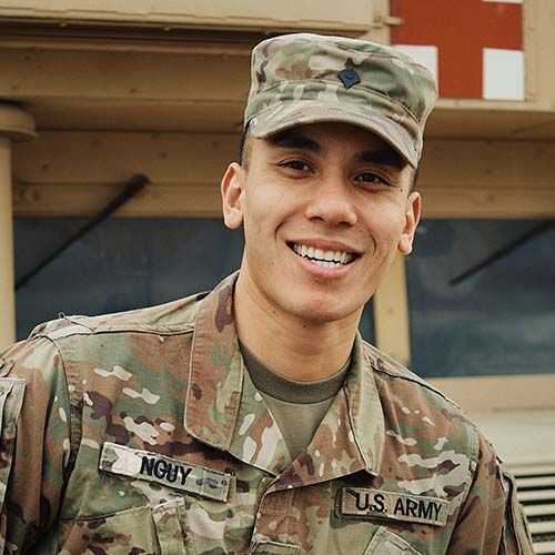Man in U.S. Army Reserve uniform smiling and facing towards his right